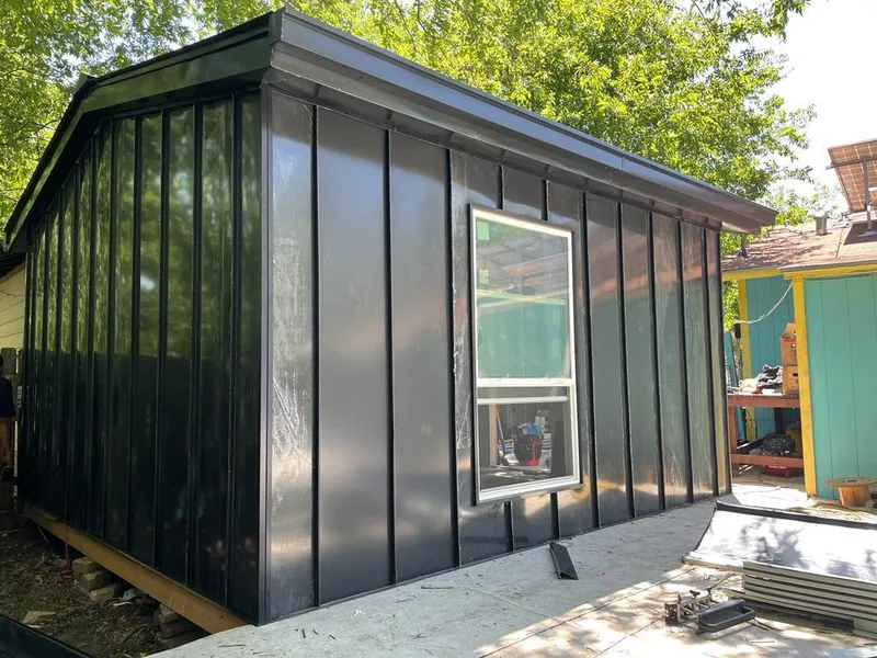 Black standing seam metal wall panels for Roof Inspection in North Vernon